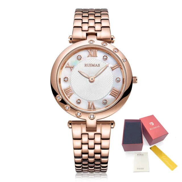 Silver luxury women's quartz bracelet watch with round face, crystal accents, Roman numerals, stainless steel band, elegant design
