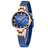 Elegant women's luxury quartz wristwatch with pink mother-of-pearl dial, crystal hour markers, rose gold mesh band, and water resistance