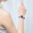 Elegant women's luxury quartz wristwatch with pink mother-of-pearl dial, crystal hour markers, rose gold mesh band, and water resistance