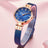 Elegant women's luxury quartz wristwatch with pink mother-of-pearl dial, crystal hour markers, rose gold mesh band, and water resistance
