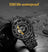 Black men's luxury automatic mechanical watch with a round dial, intricate skeleton design, stainless steel strap, and modern style