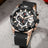 Luxury men's chronograph sports watch with large 48.5mm black bezel, black leather strap, rose gold case, and detailed dial with subdials and date windowLuxury men's chronograph sports watch with large 48.5mm black bezel, black leather strap, rose gold case, and detailed dial with subdials and date window