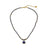 Elegant beaded necklace featuring deep blue lapis lazuli stones and gold accents with a round lapis lazuli pendant, perfect for sophisticated style.