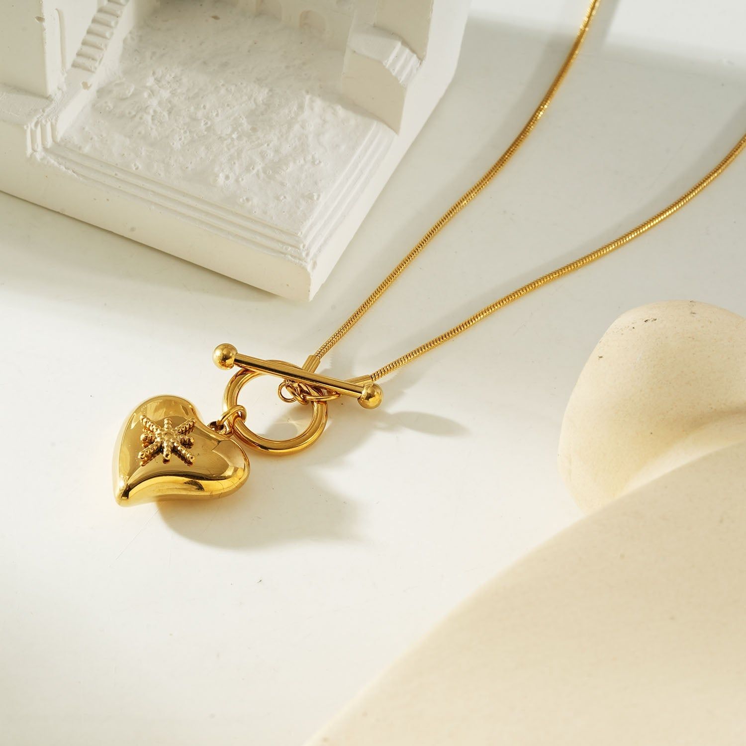 Gold heart toggle pendant necklace with a shiny gold finish, featuring a heart-shaped charm and toggle clasp, perfect for everyday wear or gifting.