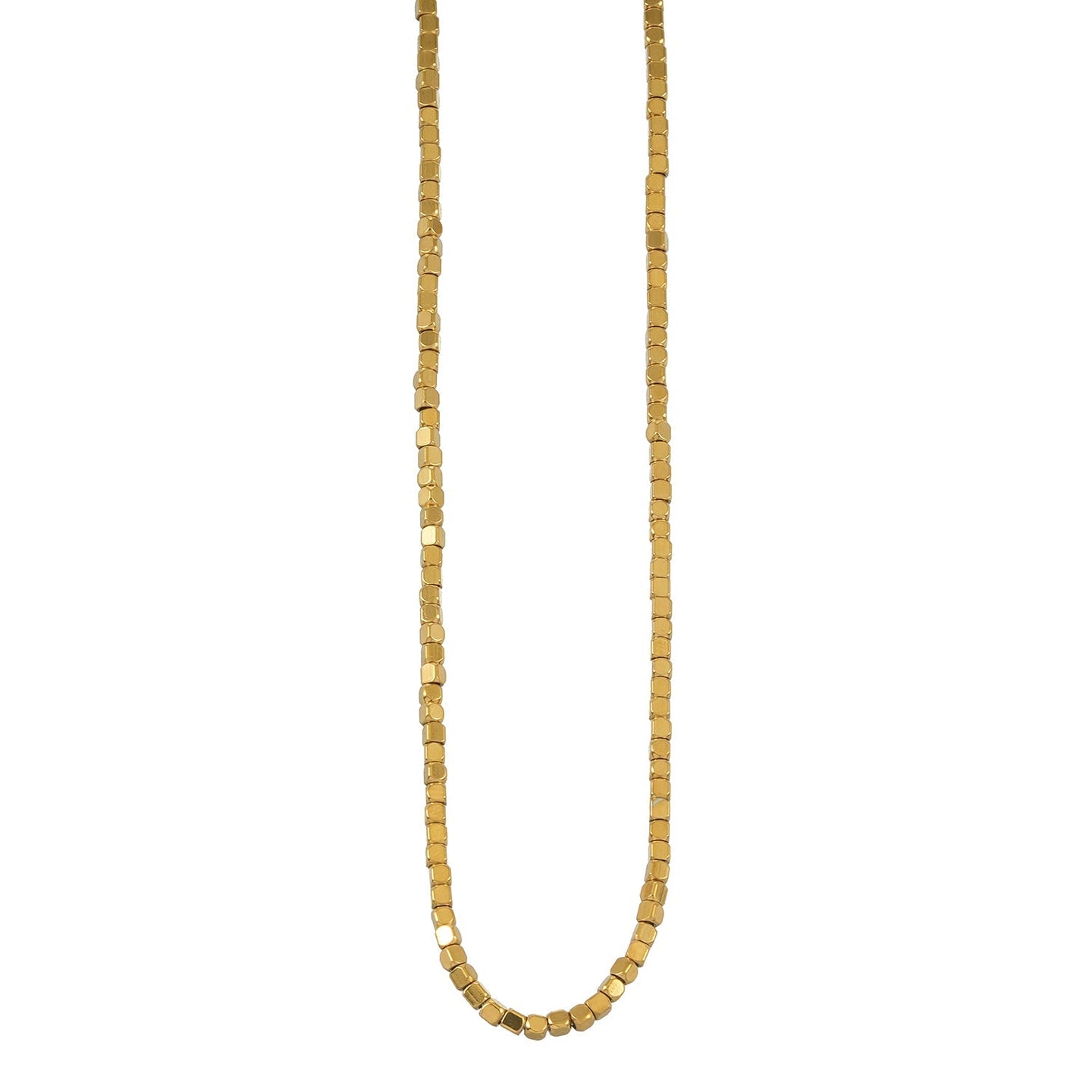 Gold beaded dainty chain necklace with small square beads, resting on a decorative ceramic dish with a scalloped edge, ideal for layering or everyday wear