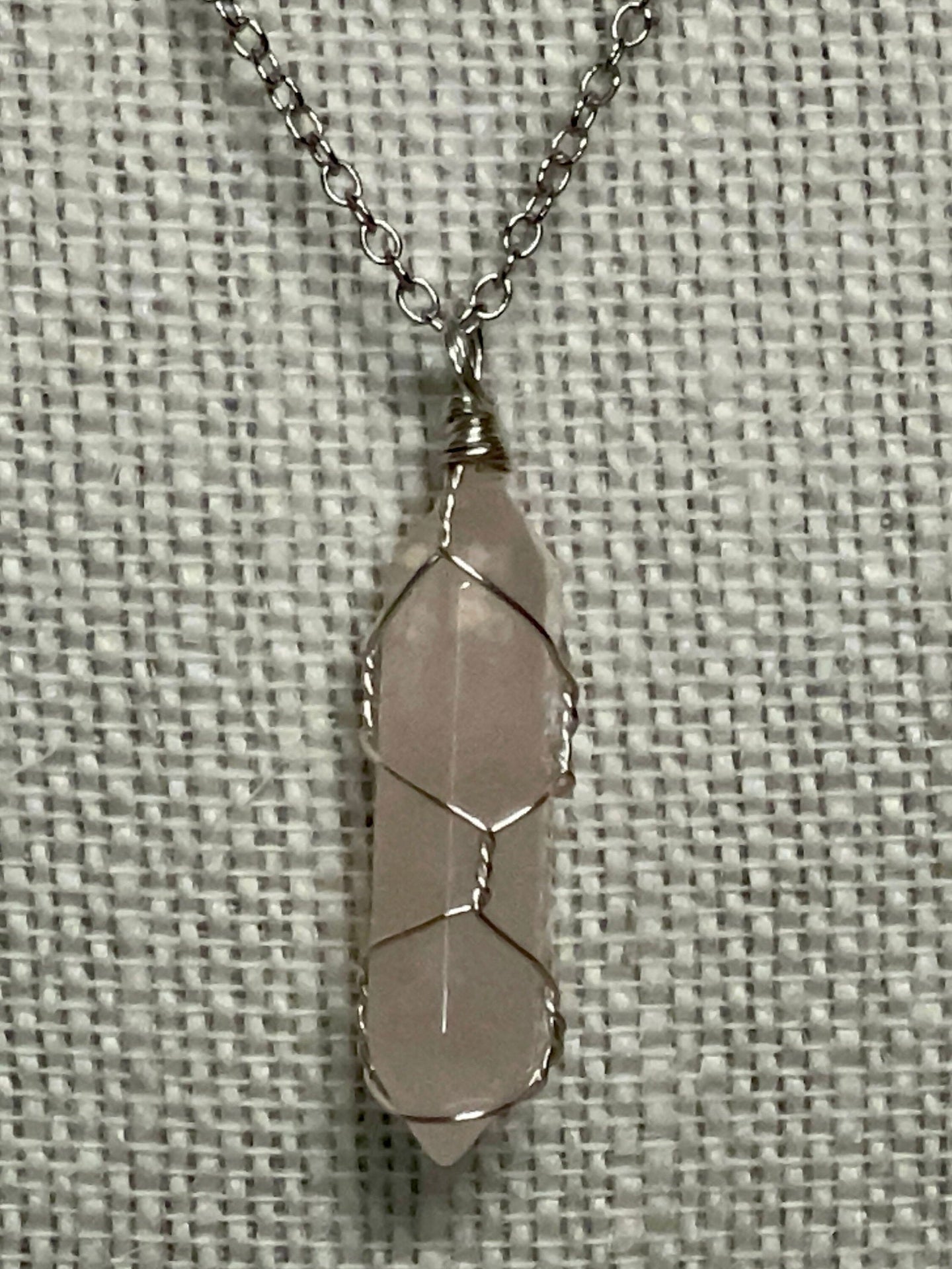 Silver chain necklace with a wire-wrapped 
