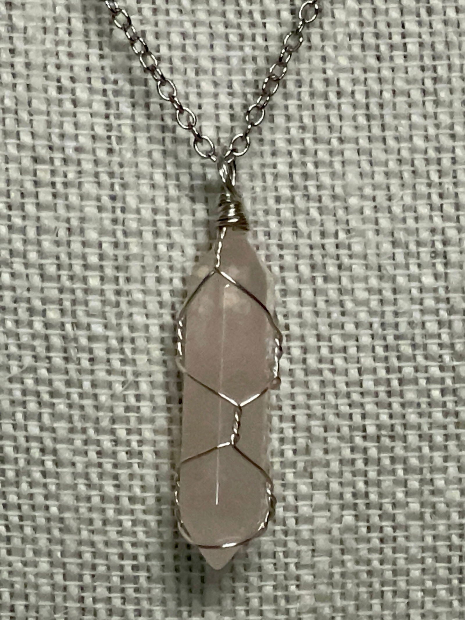 Silver chain necklace with a wire-wrapped 