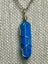 Silver chain necklace with a wire-wrapped 
