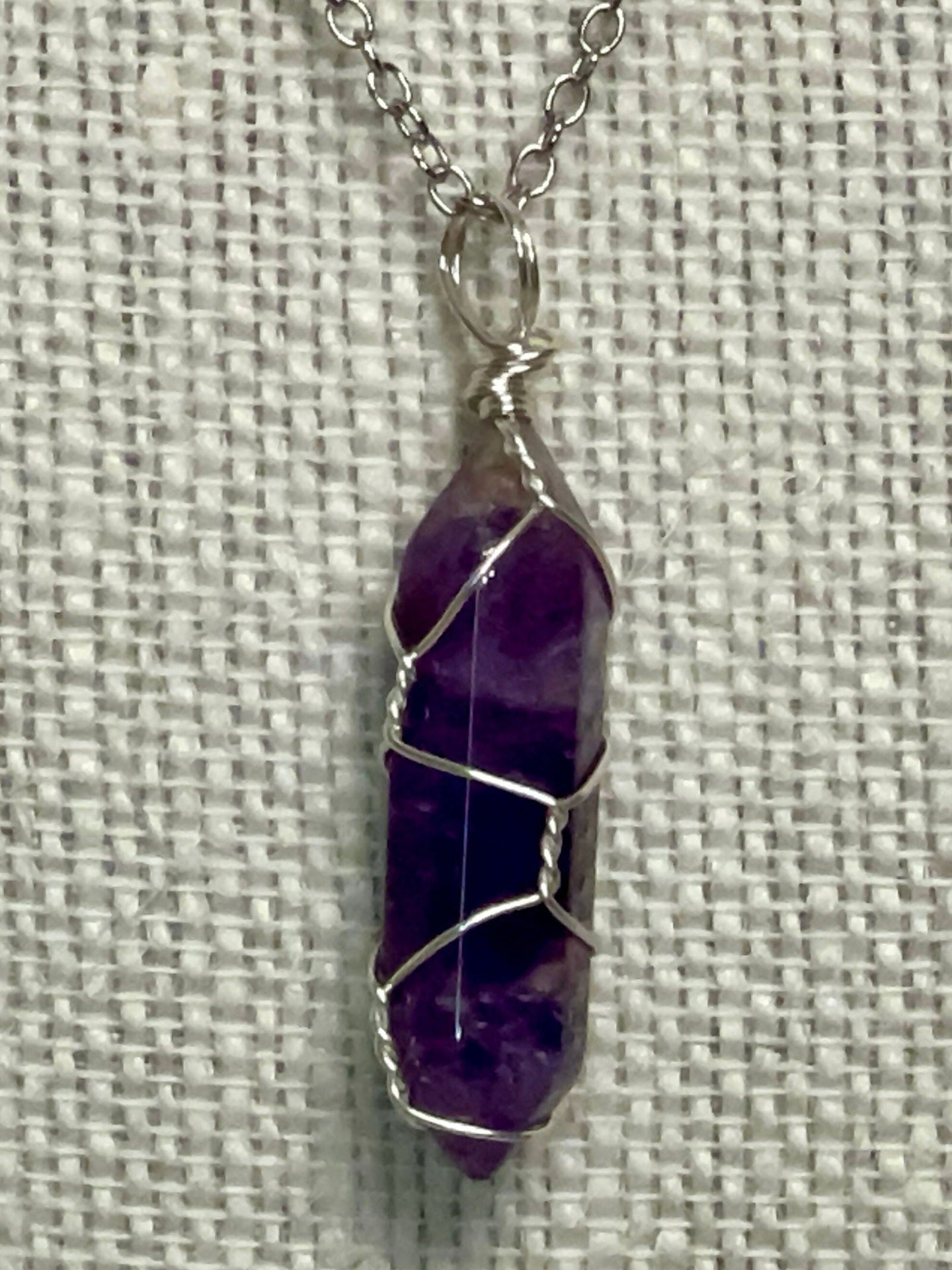 Silver chain necklace with a wire-wrapped 