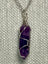 Silver chain necklace with a wire-wrapped 