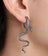 Silver snake dangle earring designed as a coiled snake with detailed scales, hanging from the earlobe for gothic jewelry style.